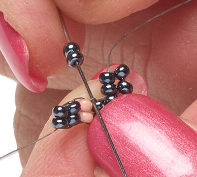 Beads threaded with a needle